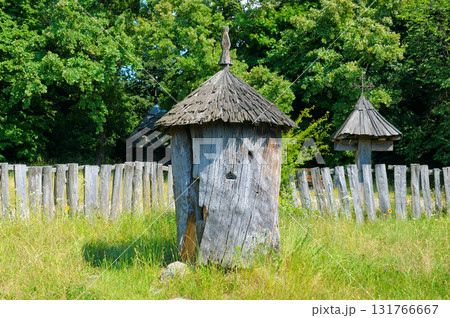 Traditional Old Wooden Log Beehive in an Open-Air Museum Traditional Old Wooden Log Beehive in an Open-Air Museum 131766667
