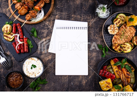 Assortment of grilled bbq meat and vegetables 131766717