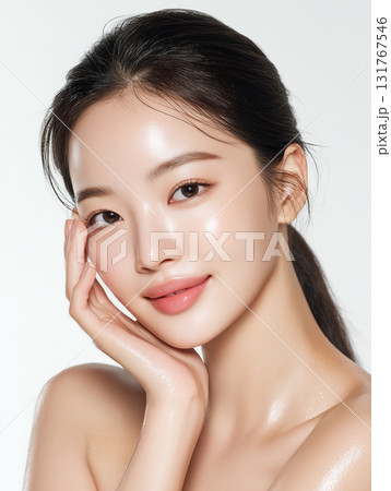 Beautiful young Korean woman showing healthy skin in a soft portrait taken in a bright studio setting Beautiful young Korean woman showing healthy skin in a soft portrait taken in a bright studio setting 131767546