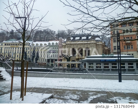 City streets, Baroque buildings, and a colonnade in winter. Snow creates a special atmosphere in the spa town. City streets, Baroque buildings, and a colonnade in winter. Snow creates a special atmosphere in the spa town. 131768049