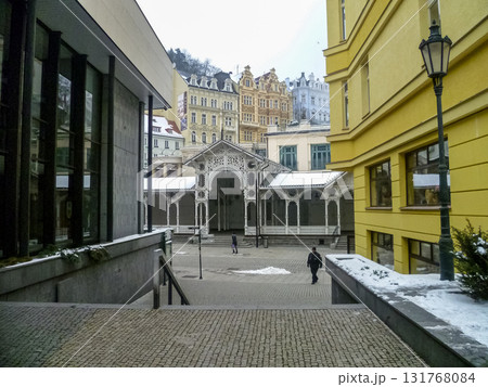 City streets, Baroque buildings, and a colonnade in winter. Snow creates a special atmosphere in the spa town. 131768084