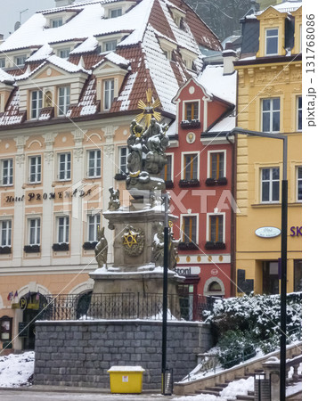 City streets, Baroque buildings, and a colonnade in winter. Snow creates a special atmosphere in the spa town. 131768086