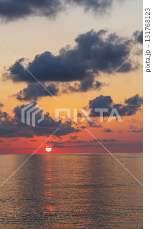 Shot of the dramatic sunset by the beach. 131768123