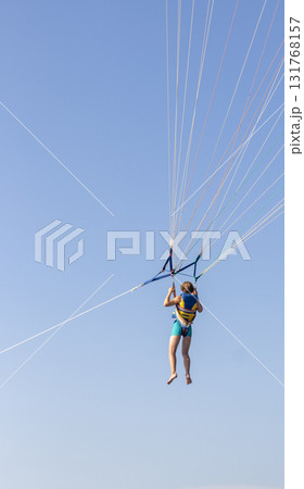 Shot of the person doing person doing parasailing activity Shot of the person doing person doing parasailing activity 131768157