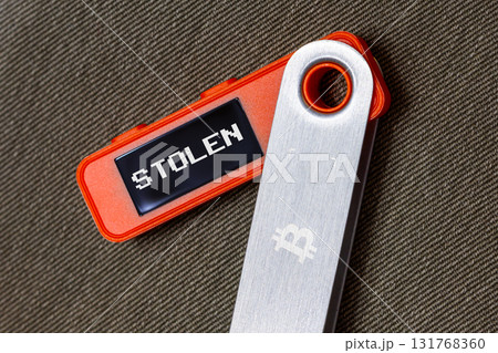 hardware Bitcoin wallet with message Stolen on screen 131768360