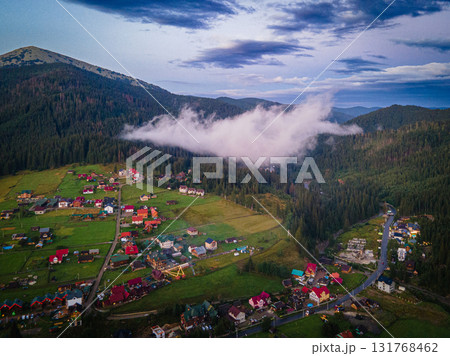 Mountainous countryside scenery at sunset. Dramatic sky above the distant valley. Green fields and trees on the hill. Beautiful nature scenery of carpathians. High quality photo Mountainous countryside scenery at sunset. Dramatic sky above the distant valley. Green fields and trees on the hill. Beautiful nature scenery of carpathians. High quality photo 131768462