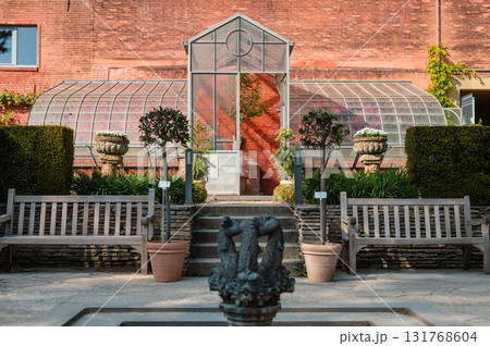 Historic botanical garden in Leuven, Belgium, featuring rare plants, serene paths, and beautiful greenhouses. Historic botanical garden in Leuven, Belgium, featuring rare plants, serene paths, and beautiful greenhouses. 131768604