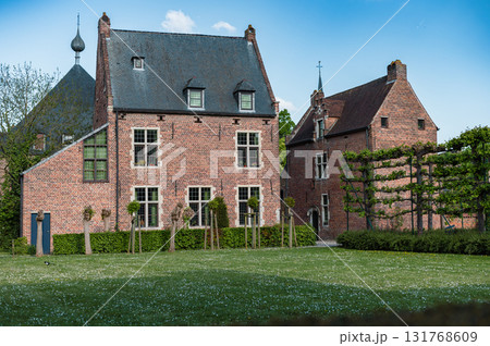 Leuven, Belgium - April 26, 2025: Historic quarter of Leuven with cobbled streets, medieval houses, and serene canals, UNESCO World Heritage Site. 131768609