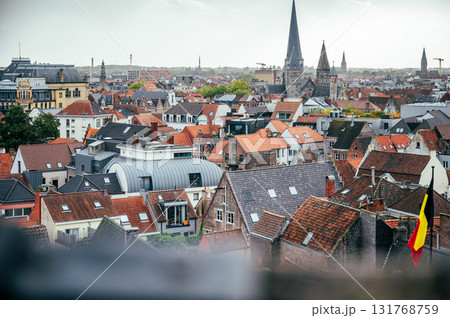 Scenic view from the medieval Gravensteen Castle overlooking the rooftops and historic buildings of Ghent. 131768759