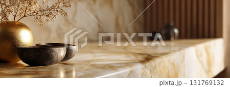 Golden vase with dried flowers and wooden bowls placed on polished marble surface Golden vase with dried flowers and wooden bowls placed on polished marble surface 131769132