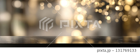 Black marble surface with soft golden bokeh lights on blurred background Black marble surface with soft golden bokeh lights on blurred background 131769133
