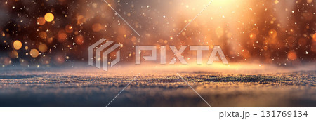 Snowy surface with falling snow and blurred forest in warm sunlight Snowy surface with falling snow and blurred forest in warm sunlight 131769134