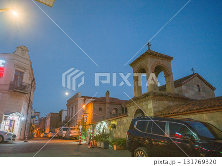 Small orthodox church on tall Kura riverbank 131769320