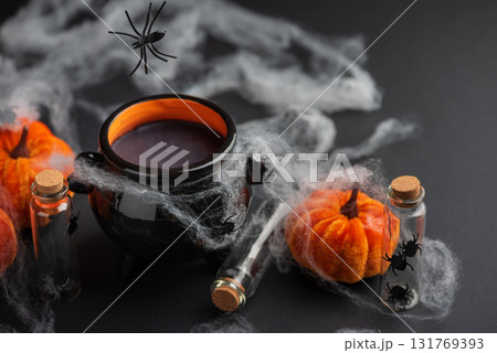 Halloween Cauldron with Pumpkins, Spiders and Cobwebs Halloween Cauldron with Pumpkins, Spiders and Cobwebs 131769393
