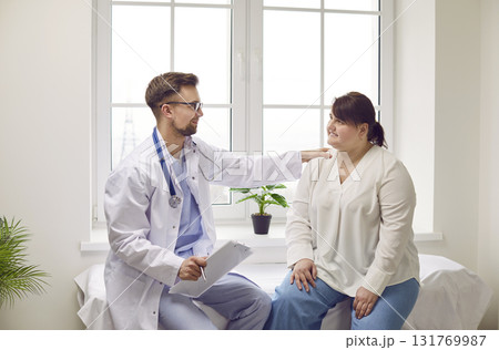 Overweight woman having consultation at doctor's office during medical examination in clinic. Overweight woman having consultation at doctor's office during medical examination in clinic. 131769987