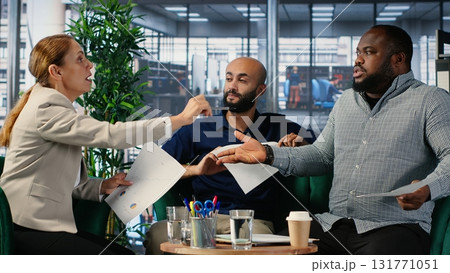 Group argument in a corporate office between diverse professionals, involving negotiation conflict and commitment issues. Business meeting with leadership frustration. Camera B. Group argument in a corporate office between diverse professionals, involving negotiation conflict and commitment issues. Business meeting with leadership frustration. Camera B. 131771051