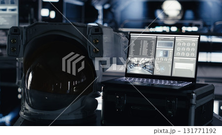 Laptop in space station tracking star and asteroids patterns during cosmic trip to Mars. Notebook interface in starship showing orbital path for upcoming extraterrestrial red planet expedition Laptop in space station tracking star and asteroids patterns during cosmic trip to Mars. Notebook interface in starship showing orbital path for upcoming extraterrestrial red planet expedition 131771192