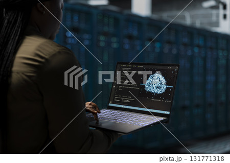 Developer uses AI neural network to do checkup on data center electronics processing datasets. Server hub worker uses machine learning to do backup on gear used by cloud storage hosting companies Developer uses AI neural network to do checkup on data center electronics processing datasets. Server hub worker uses machine learning to do backup on gear used by cloud storage hosting companies 131771318