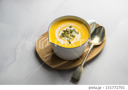 Homemade pumpkin cream soup in a bowl, bright background Homemade pumpkin cream soup in a bowl, bright background 131772701