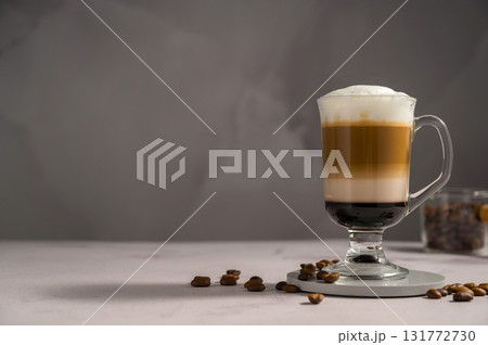 Layered coffee latte drinks. Hot coffee drinks in glass mugs, copy space 131772730