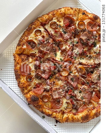 A delicious pizza with a golden crust, melted cheese, and savory toppings. Perfect for food-related designs, menus, or Italian-themed projects, capturing the essence of a classic comfort dish. A delicious pizza with a golden crust, melted cheese, and savory toppings. Perfect for food-related designs, menus, or Italian-themed projects, capturing the essence of a classic comfort dish. 131774068