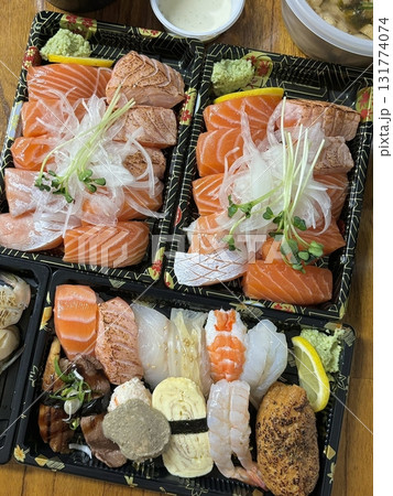 An assortment of fresh sushi, artfully arranged with a variety of toppings and vibrant colors. This traditional Japanese dish combines vinegared rice, seafood, and vegetables for an experience. An assortment of fresh sushi, artfully arranged with a variety of toppings and vibrant colors. This traditional Japanese dish combines vinegared rice, seafood, and vegetables for an experience. 131774074