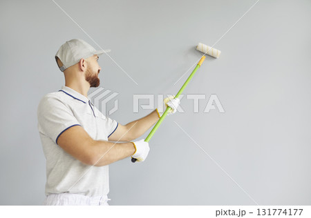 Professional service, successful male painter, construction man worker painting Professional service, successful male painter, construction man worker painting 131774177