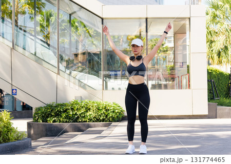 Stretch for people, fit woman performs outdoor sport workout, engaging in exercise, preparing for activity, healthy lifestyle practice, full body stretch. 131774465