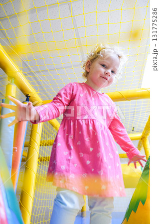 The child plays in a special playroom with different toys The child plays in a special playroom with different toys 131775286