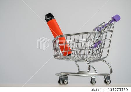 Disposable vape in a customer's cart. Disposable vape in a customer's cart. 131775570