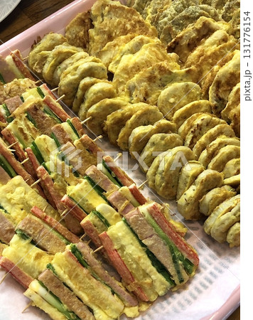 Korean traditional food, jeon, vegetable, meat, etc. are mixed with eggs and fried in oil. Always put it on the table when I hold a memorial service for ancestors on Chuseok (Thanks giving Day) Korean traditional food, jeon, vegetable, meat, etc. are mixed with eggs and fried in oil. Always put it on the table when I hold a memorial service for ancestors on Chuseok (Thanks giving Day) 131776154