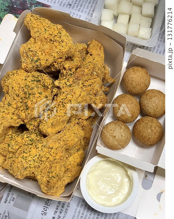 Crispy fried chicken with golden, crunchy skin and juicy, tender meat. A delicious and savory dish, perfect for any meal, served with dipping sauces or side dishes for extra flavor! 131776214