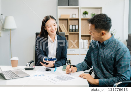 Capturing a cheerful business consultation scene with smiling professionals, perfect for illustrating corporate success, teamwork, 131776618