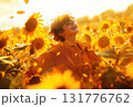 Boy with light brown hair joyfully playing in a sunlit field of sunflowers during golden hour 131776762