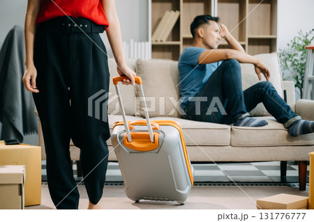 Divorce. Asian couples are desperate and disappointed after marriage. Husband and wife are sad, upset and frustrated after quarrels. family problem, teenage love. on sofa 131776777