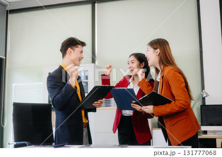 Professional teamwork as business colleagues engage in strategy, planning, and discussion Professional teamwork as business colleagues engage in strategy, planning, and discussion 131777068