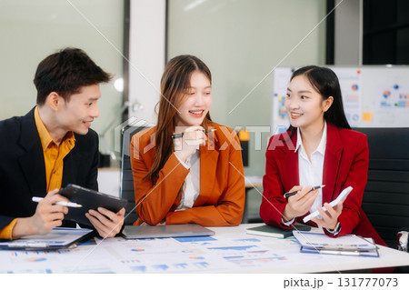 Professional teamwork as business colleagues engage in strategy, planning, and discussion 131777073