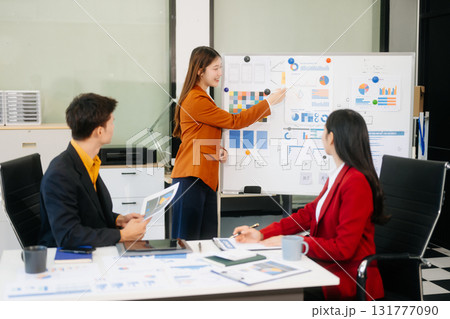 Office colleagues have a casual discussion. During a meeting in a conference room, a group of business teem Office colleagues have a casual discussion. During a meeting in a conference room, a group of business teem 131777090