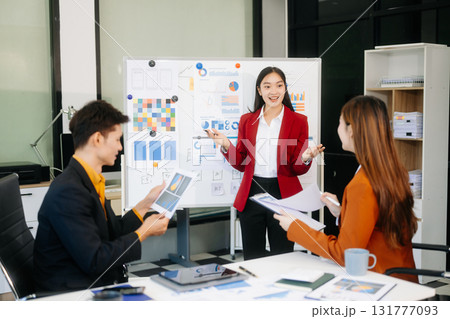 Office colleagues have a casual discussion. During a meeting in a conference room, a group of business teem Office colleagues have a casual discussion. During a meeting in a conference room, a group of business teem 131777093