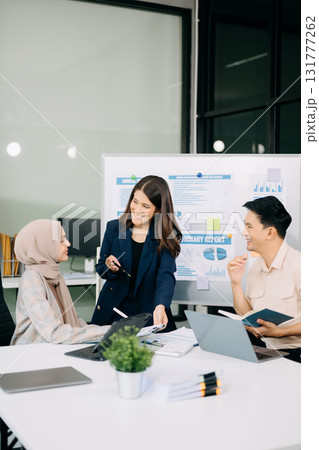 Group of Asian business meeting in planning design in creative business discussing work 131777262