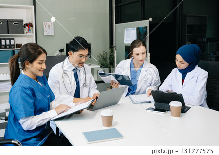 Medical, meeting and laptop for team in discussion, brainstorming and planning. Doctor, nurse on desk show diversity in collaboration, teamwork or workshop in hospital Medical, meeting and laptop for team in discussion, brainstorming and planning. Doctor, nurse on desk show diversity in collaboration, teamwork or workshop in hospital 131777575