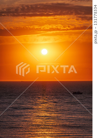 Beautiful red and orange sunrise over the sea. Beautiful red and orange sunrise over the sea. 131778334