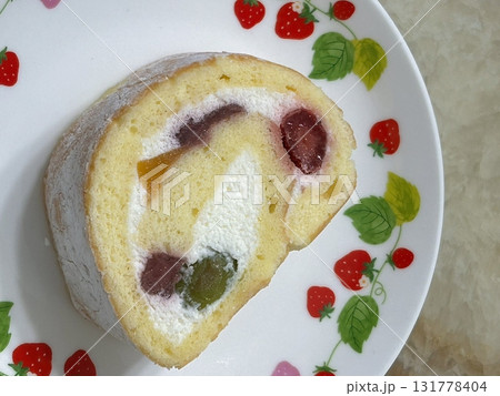 A soft, fluffy roll cake with a delicate sponge and creamy filling, perfect for a light dessert or afternoon snack. A sweet, indulgent treat with a smooth texture and rich flavor. A soft, fluffy roll cake with a delicate sponge and creamy filling, perfect for a light dessert or afternoon snack. A sweet, indulgent treat with a smooth texture and rich flavor. 131778404