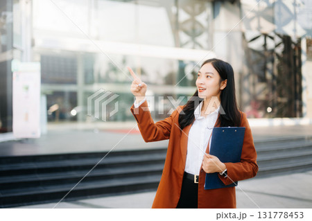 Working woman concept a female manager attending video conference and holding tablet, smatrphone 131778453