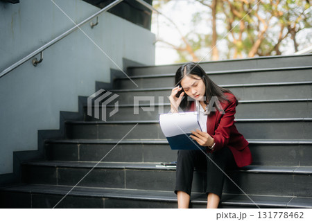 Young Asian business woman leader entrepreneur, professional manager holding digital tablet computer in big city 131778462