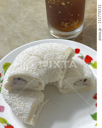 A classic sugar donut with a soft, fluffy texture and coated in a sweet layer of sugar. Perfectly simple yet satisfying, offering a delightful treat with every bite. 131778531