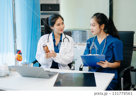 Healthcare professionals analyzing test results with lab tools, stethoscopes in a clinical setting. Showcase teamwork Healthcare professionals analyzing test results with lab tools, stethoscopes in a clinical setting. Showcase teamwork 131778561