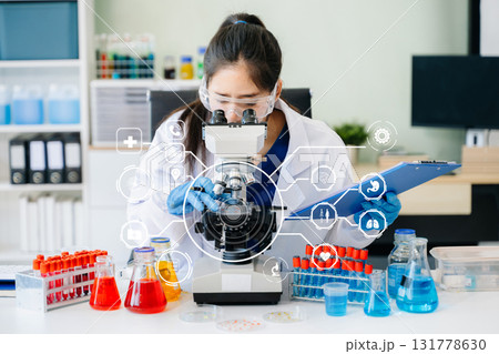 DNA molecule testing concepts. The doctor in a mask examines DNA molecules on the chemical laboratory 131778630