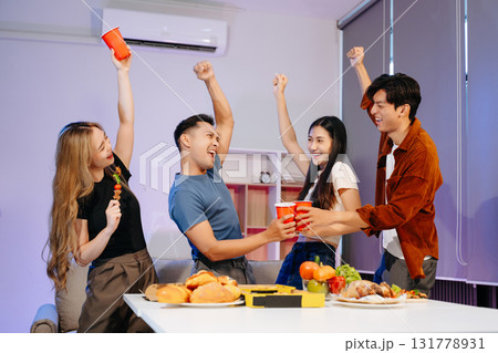 Celebrate friendship with delicious food, drinks, and cheerful moments indoors perfect 131778931