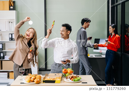 Lively office party with coworkers celebrating, enjoying pizza and drinks, and fostering team spirit Lively office party with coworkers celebrating, enjoying pizza and drinks, and fostering team spirit 131779260